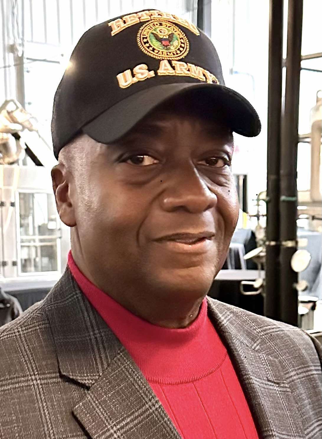 Rick Crosson, U.S. Army veteran and Democratic candidate in Wisconsin, wearing a veteran cap and blazer.