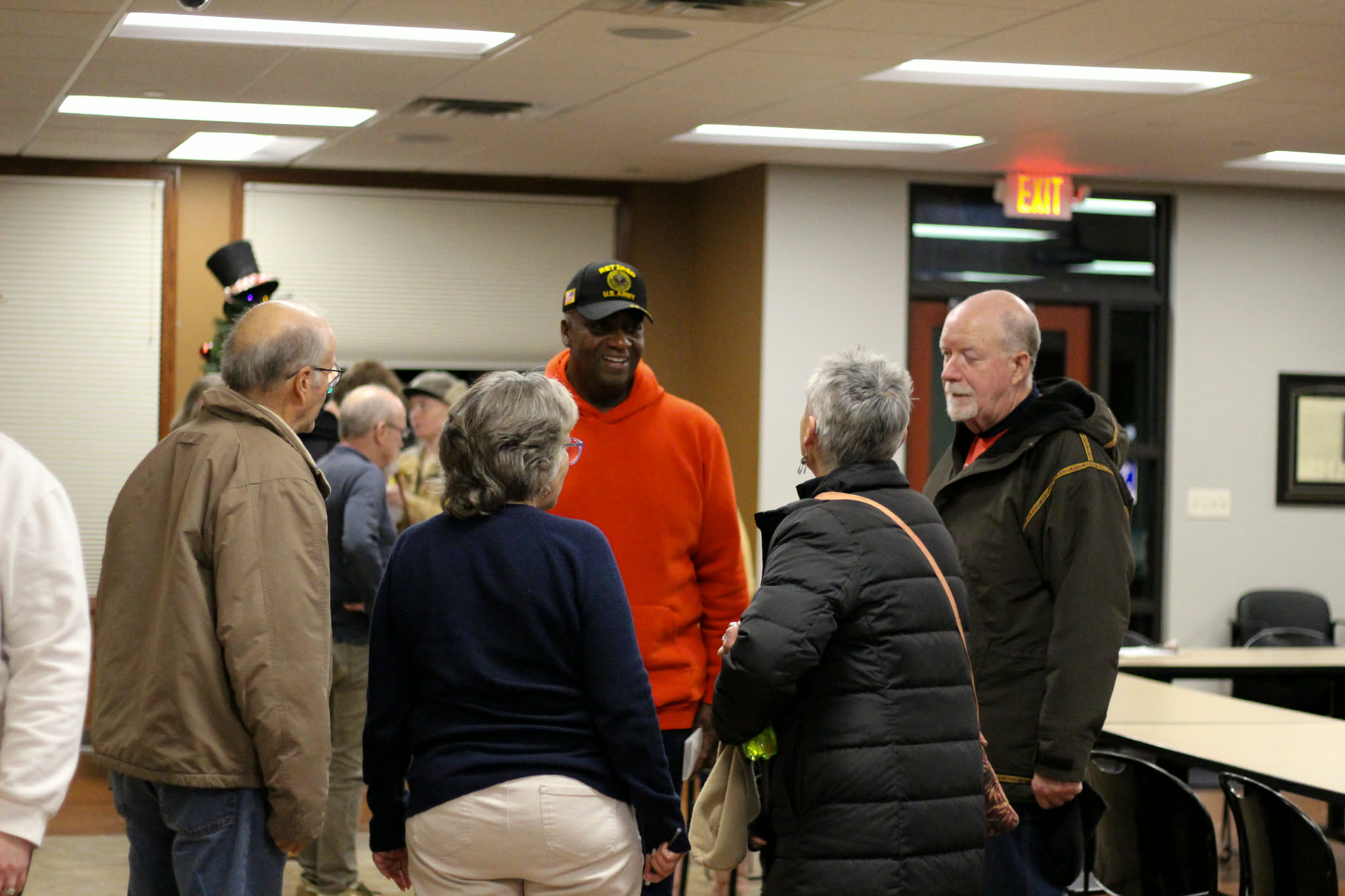 Rick speaking with community members